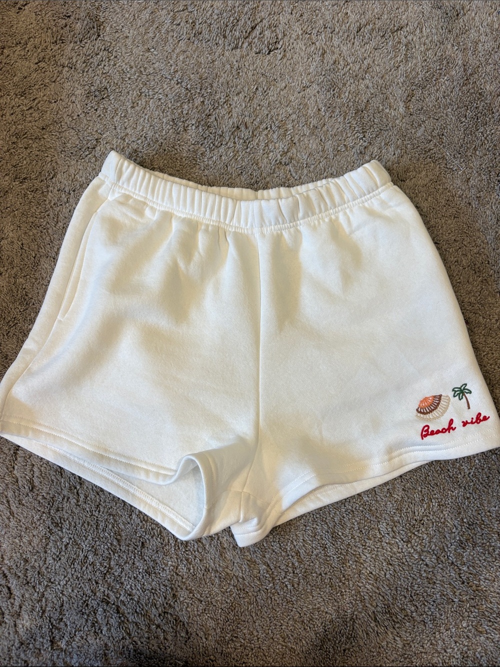Vintage White Athletic Shorts with Embroidered Beach Motif